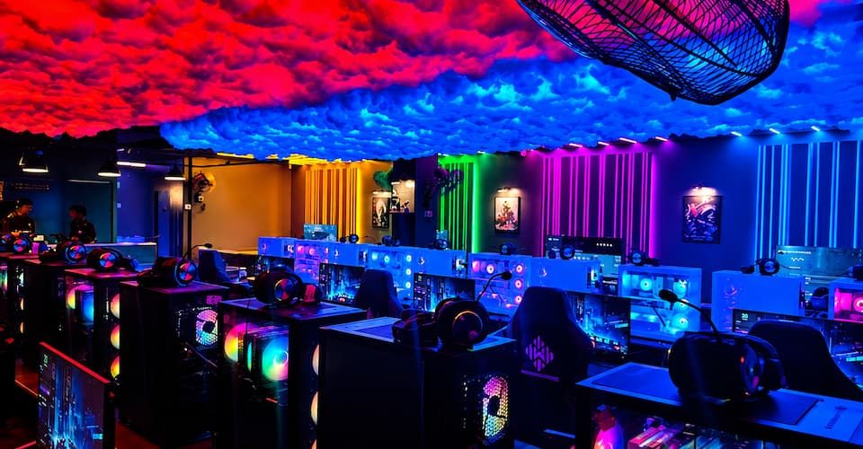 Bright RGB gaming stations under colorful ambient lights